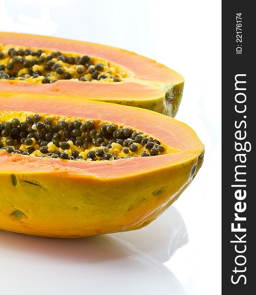 Ripe papaya on white background