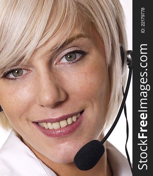 Portrait of pretty young woman using a headset. Portrait of pretty young woman using a headset