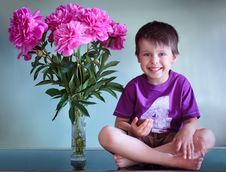 Portrait Of A Cute Boy With Peonies Royalty Free Stock Photos