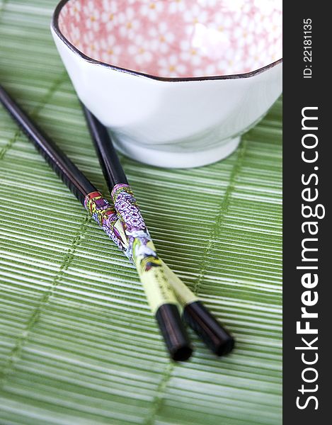 Japanese chopsticks beside blossom rice bowl