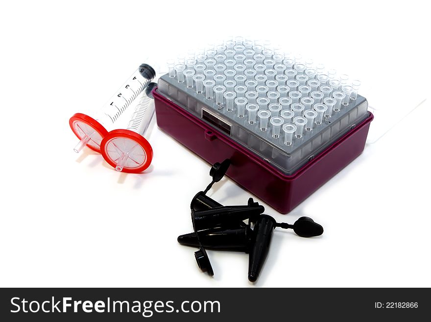Laboratory tubes, tips and filters on white background. Laboratory tubes, tips and filters on white background