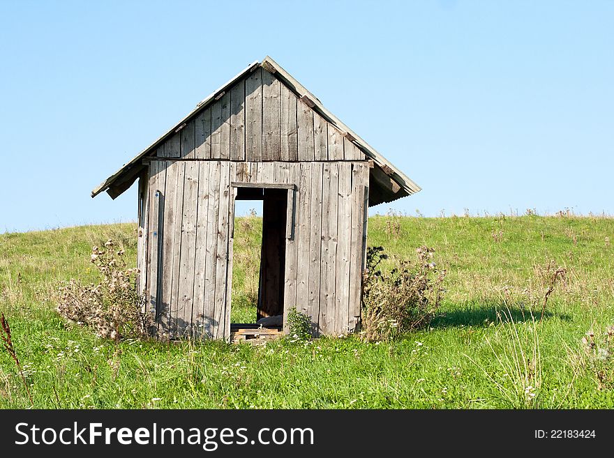 Wooden structure in the middle of field. Wooden structure in the middle of field