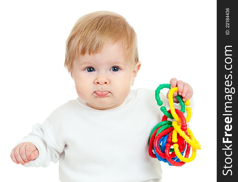 Cute little child playing with colored toys, isolated over white background. Cute little child playing with colored toys, isolated over white background