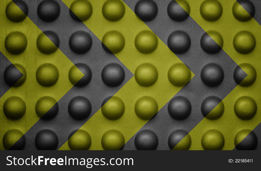 Yellow And Black Warning Sign On Bubble Texture.