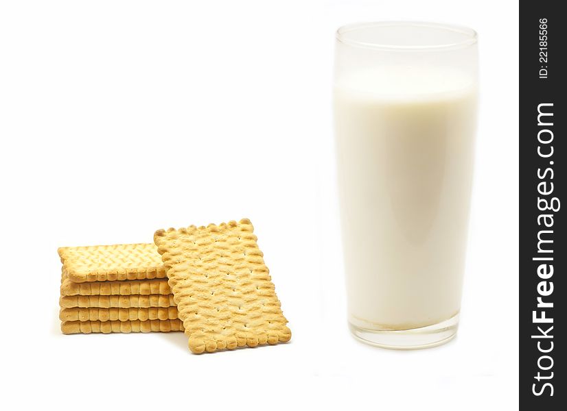 A glass of milk and six biscuits in white background. A glass of milk and six biscuits in white background