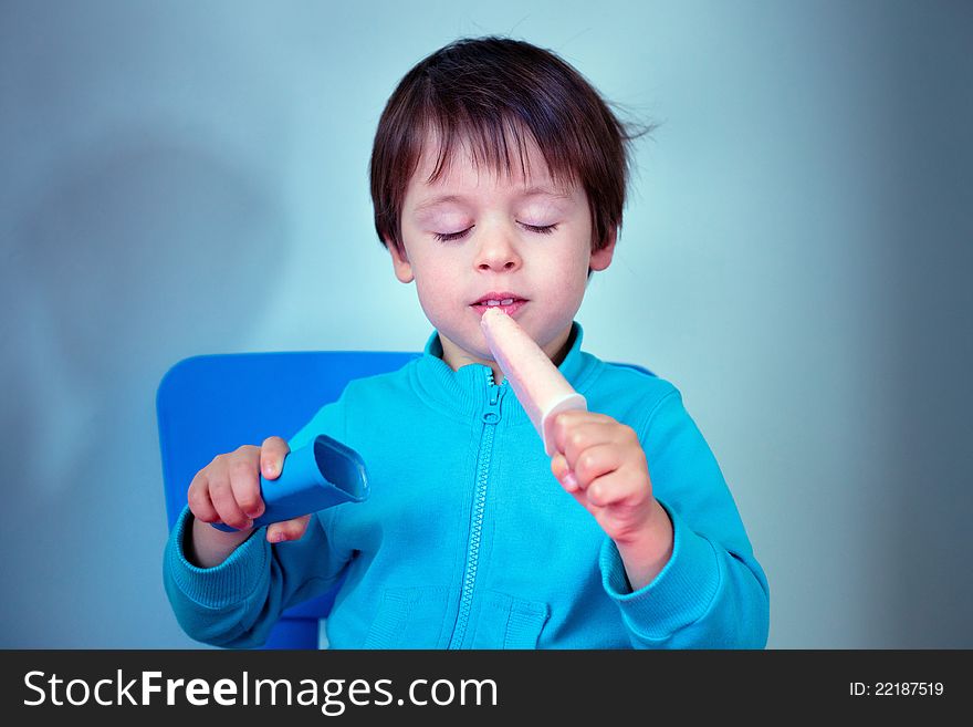 Little boy tasting homemade ice cream