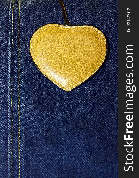 Brown Leather Heart On Blue Jeans Background