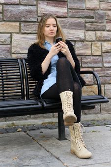 Checking Messages At The Park Stock Photo Checking Messages At The Park Stock Photo