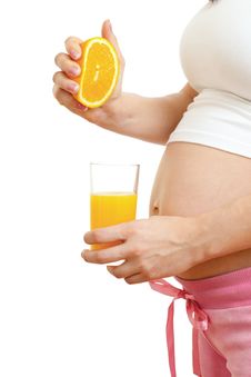 Pregnant Woman Drinking Fresh Orange Juice Royalty Free Stock Photography
