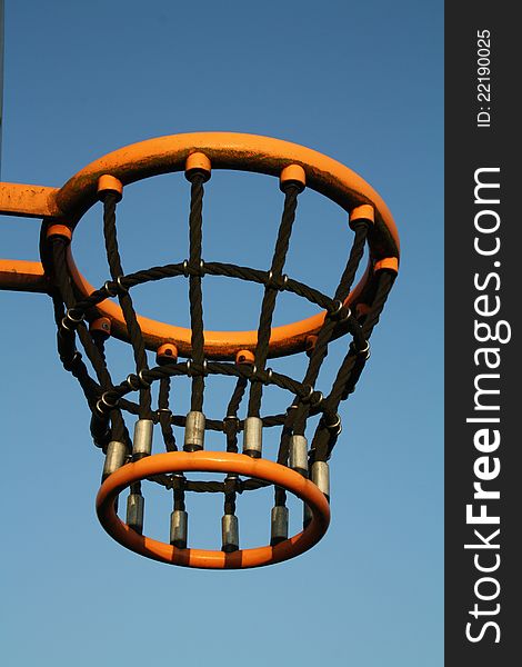 Basketball basket with a blue sky