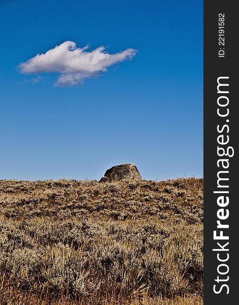Landscape with sky grass, cloud with one lonely rock. Landscape with sky grass, cloud with one lonely rock