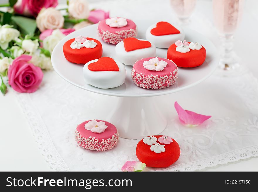 Sweet Valentine Petit Fours on a cake stand. Sweet Valentine Petit Fours on a cake stand