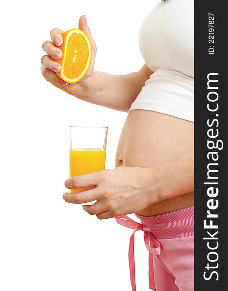 Pregnant woman drinking fresh orange juice