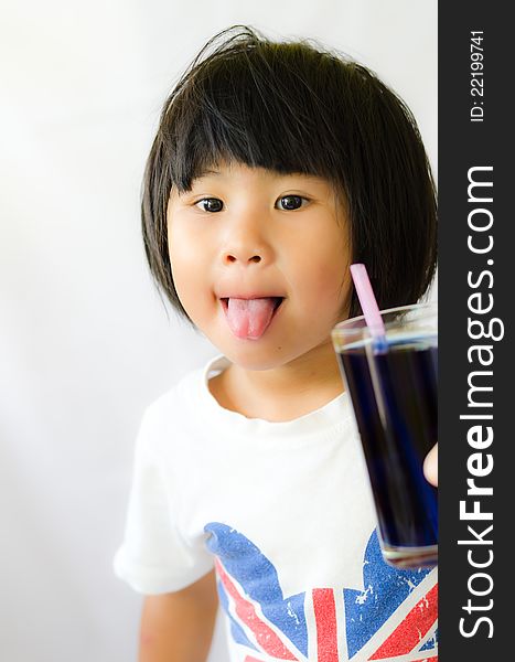 A girl show her tongue with butterfly pea juice