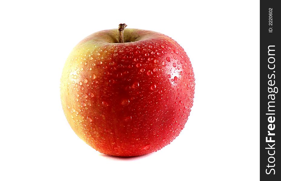Photo of isolated fresh red apple with dew.