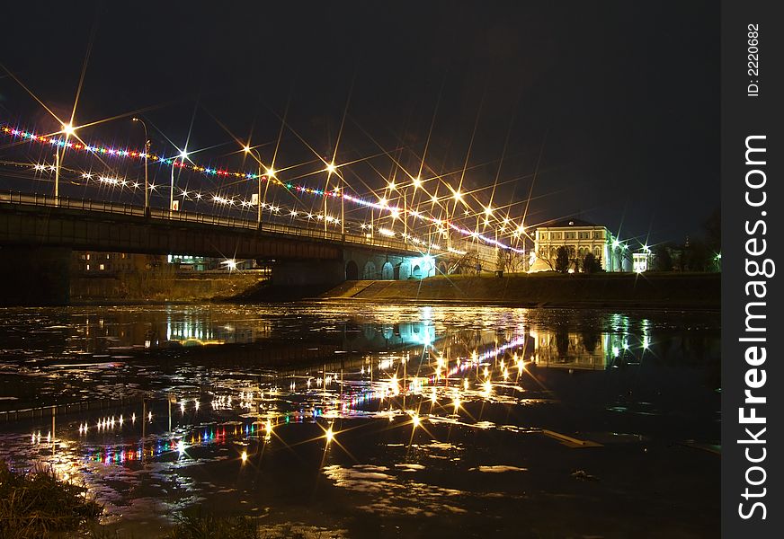 Bridge in the late evening, decorated by celebratory garlands. Bridge in the late evening, decorated by celebratory garlands