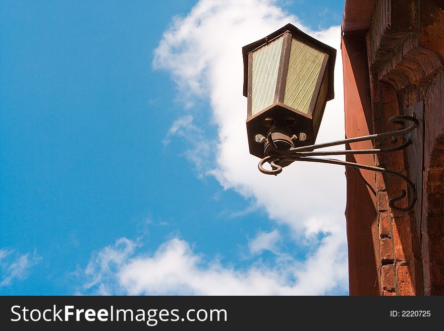 Old street lantern on a background of  blue sky
