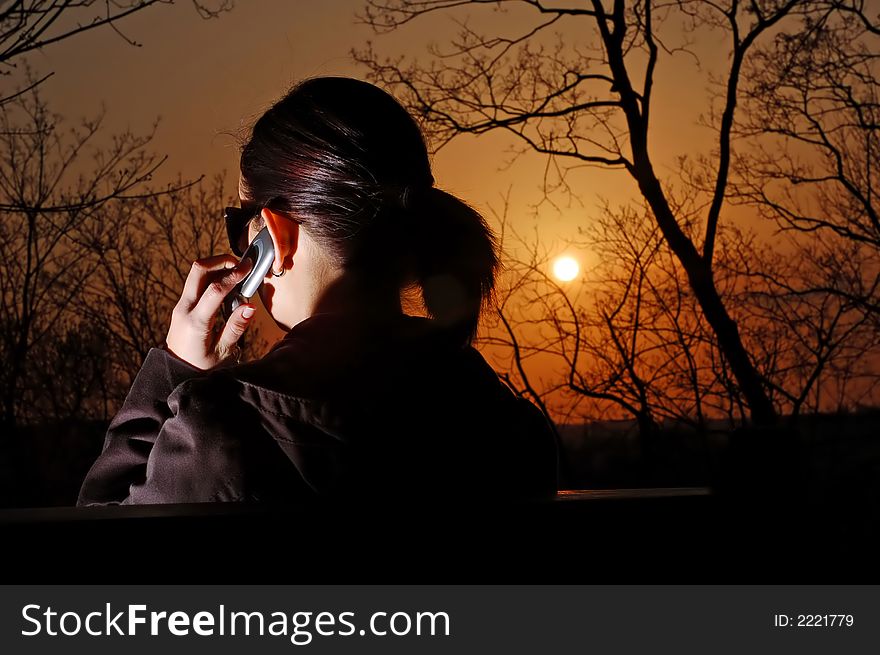 Photo of pretty female with cell phone. Photo of pretty female with cell phone.