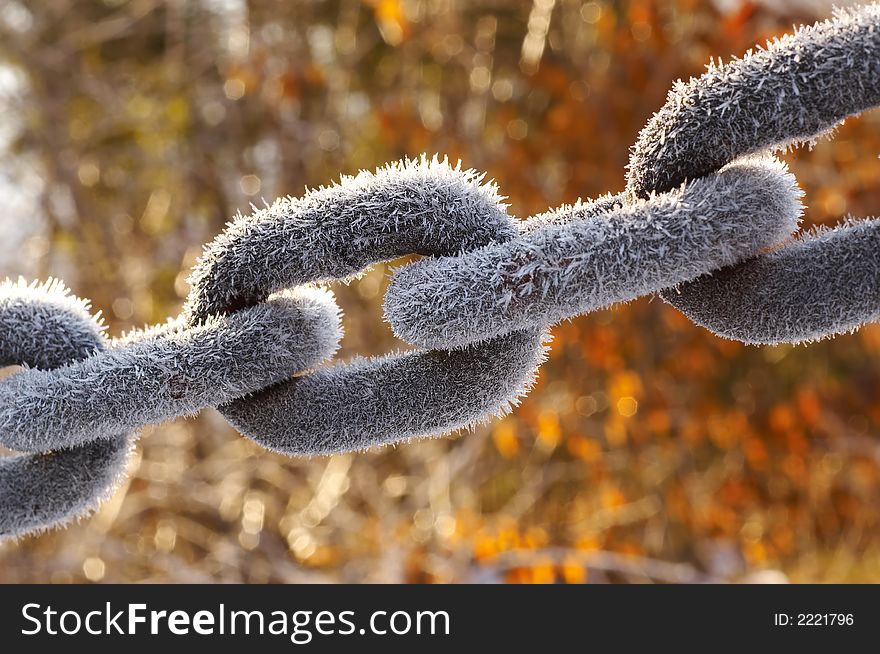 Detail of Frozen chain covered with ice crystals