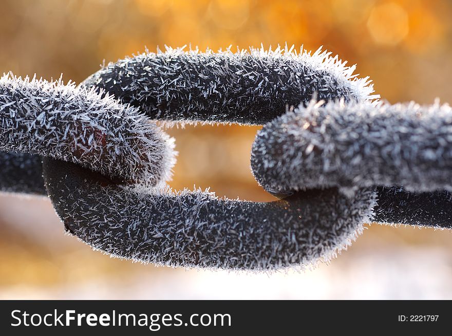 Detail of Frozen chain covered with ice crystals