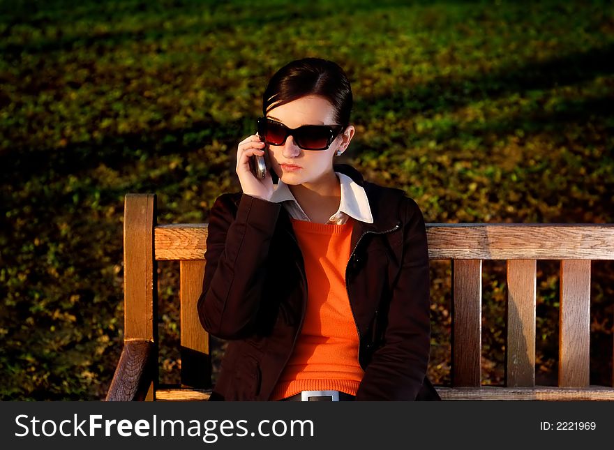 Photo of pretty female with cell phone. Photo of pretty female with cell phone.