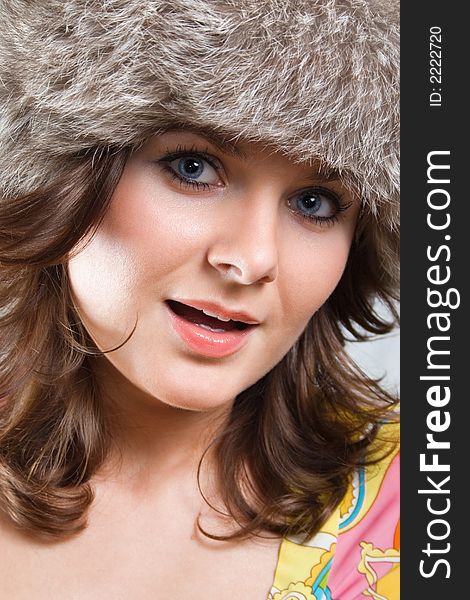 Portrait of a white beautiful woman in a fur hat. Portrait of a white beautiful woman in a fur hat