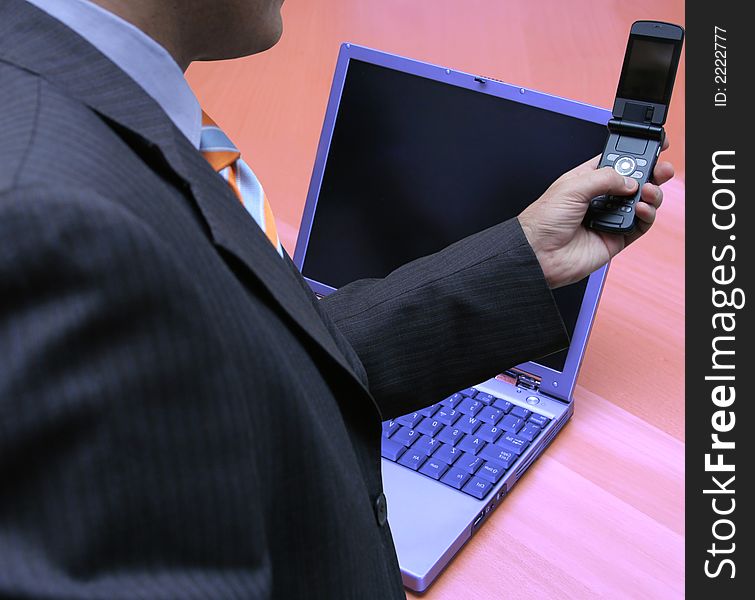 Businessman configuring his network in the office