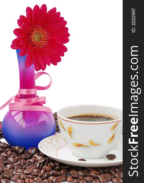Coffee with gerbera and coffee beans on white. Coffee with gerbera and coffee beans on white
