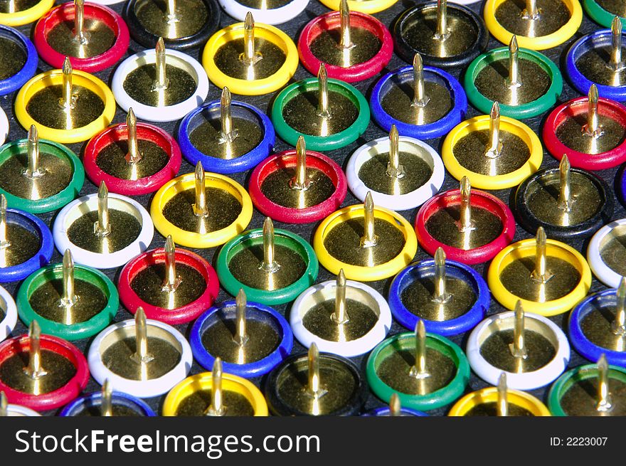 A large collection of colorful thumb tacks. A large collection of colorful thumb tacks.