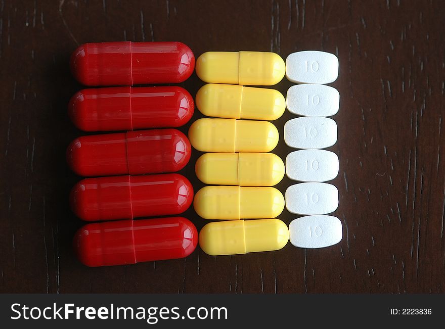 Pills are all in order on table. Pills are all in order on table