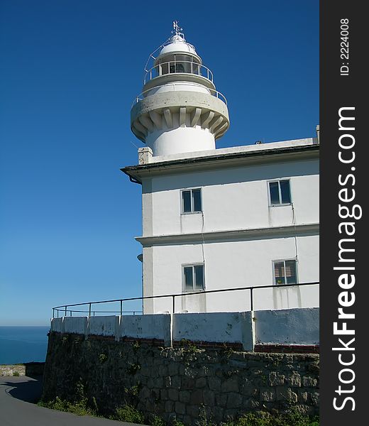 White old lighthouse in the coast