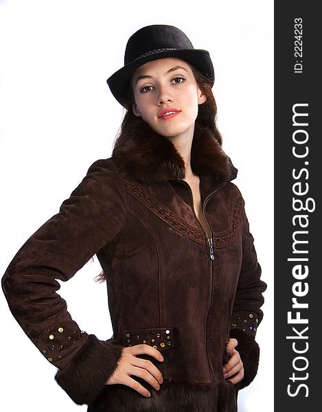 White girl with jacket and hat on the white background. White girl with jacket and hat on the white background