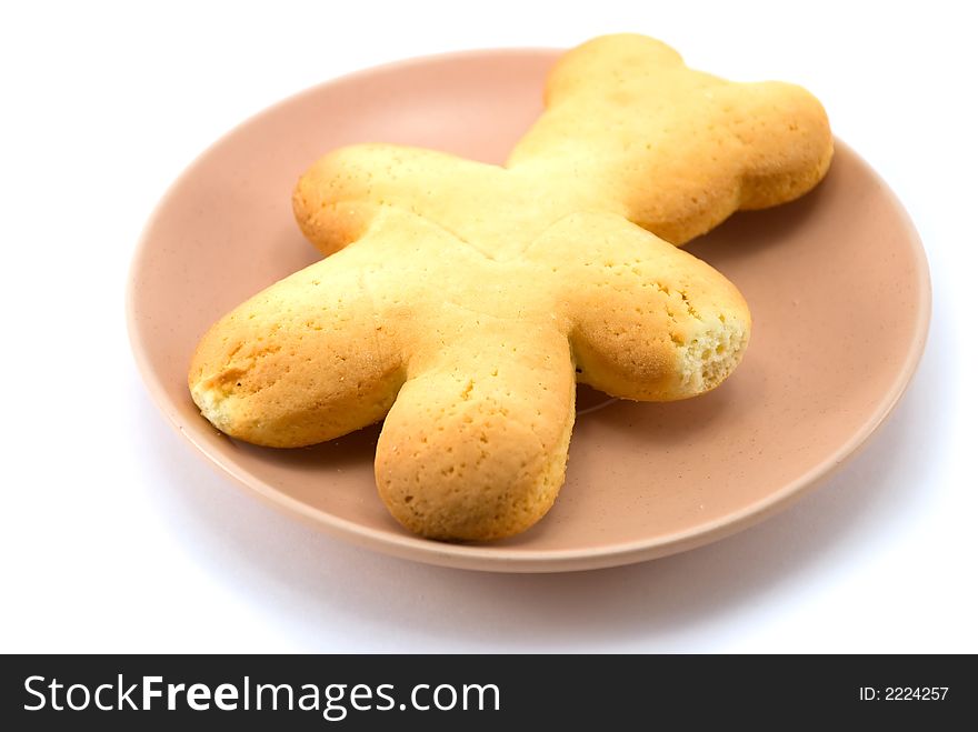 Beautiful cookies as a bear on a plate on a white background. Beautiful cookies as a bear on a plate on a white background