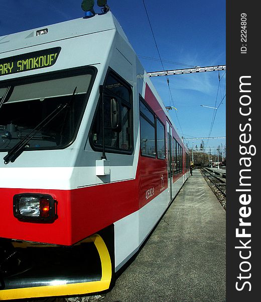 Double-ended tram uder the mountains