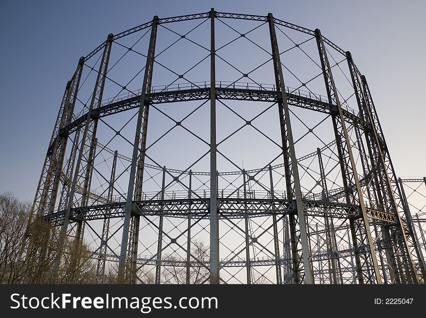 The supporting structure of a gas storage tank against evening sky. The supporting structure of a gas storage tank against evening sky