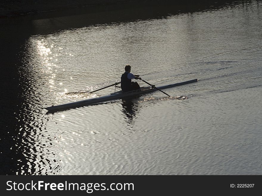 Silhouette of sculler or rower on River Clyde, Glasgow. Silhouette of sculler or rower on River Clyde, Glasgow