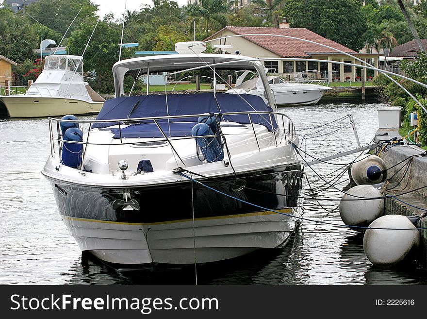 Blue and White Yacht tied up at a dock