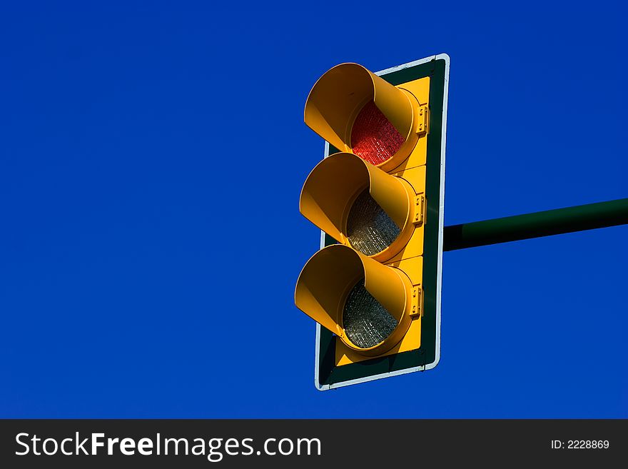 Red stop traffic light on blue sky. Red stop traffic light on blue sky