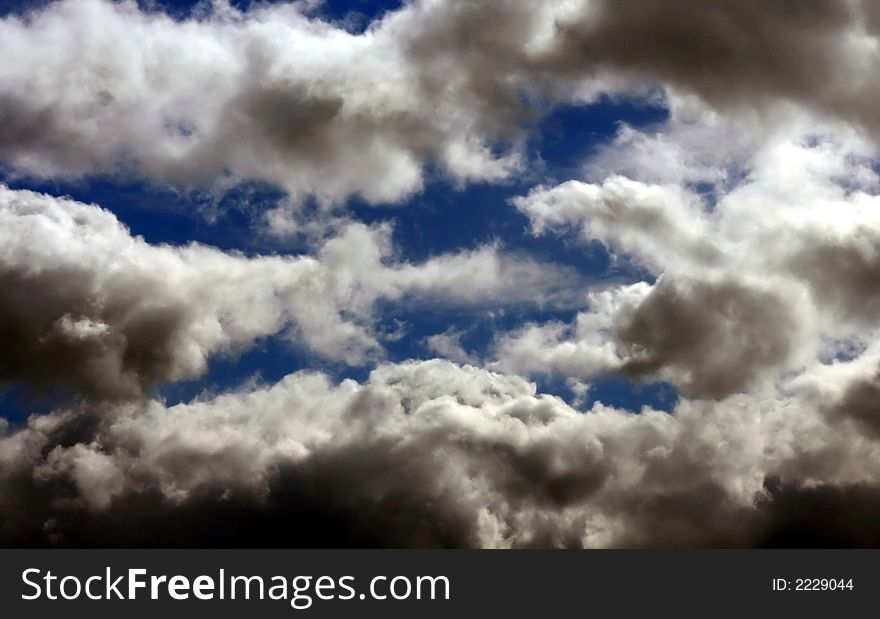 Blue sky with white and dark clouds. Blue sky with white and dark clouds