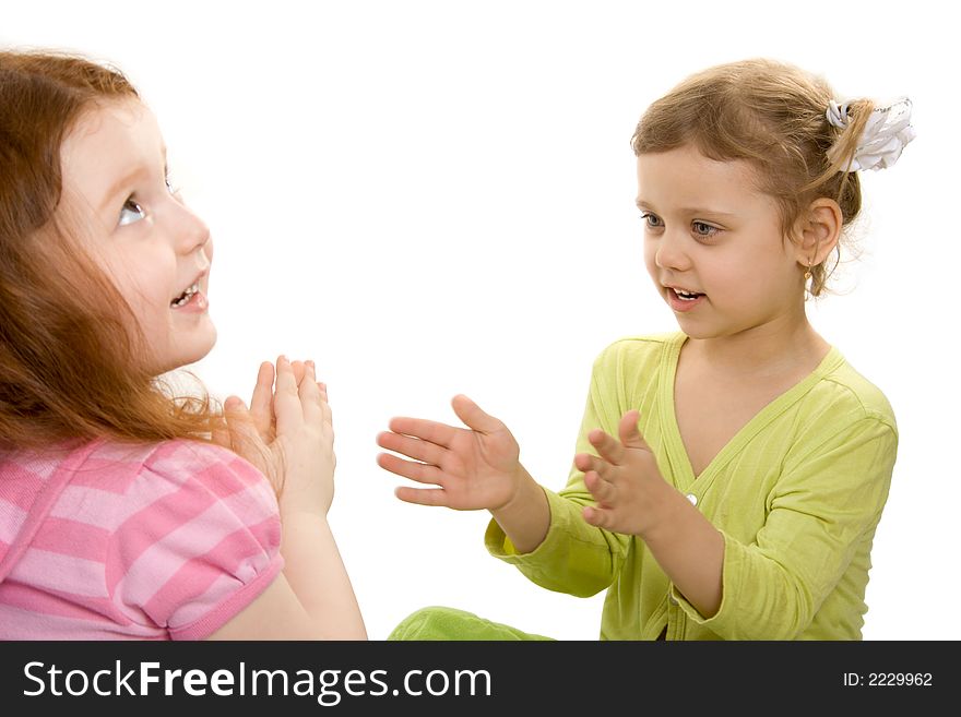 Two little girls play, isolate over white