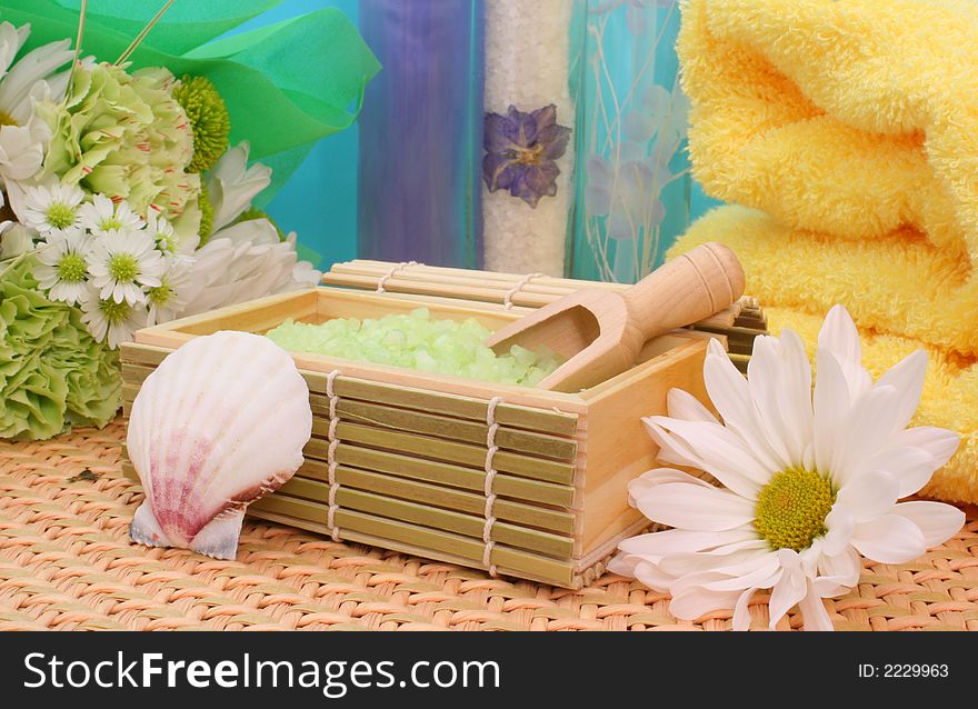 Bath Salts with Flowers and Towel on Blue Background. Bath Salts with Flowers and Towel on Blue Background