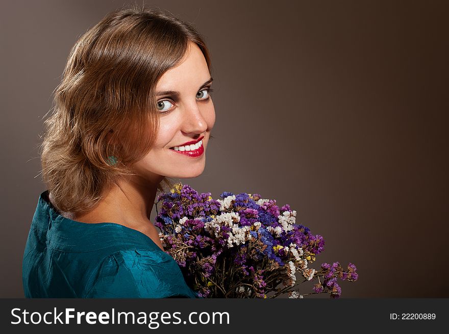 Portrait of smiling woman with flowers