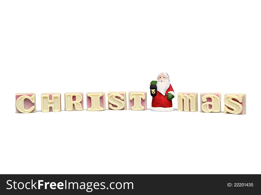 Santa clause with the letters of white chocolate on white background