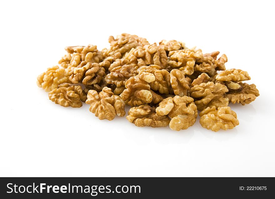 Cracked walnuts cores on white background. Cracked walnuts cores on white background