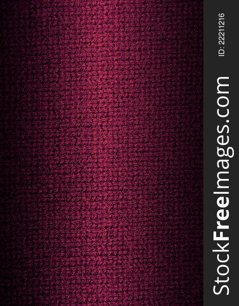 Background a texture a knitted woolen fabric of dark crimson color. Vertical. Background a texture a knitted woolen fabric of dark crimson color. Vertical