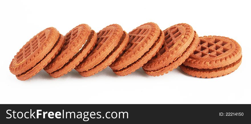 Stack of chocolate cream oreo cookies over white.