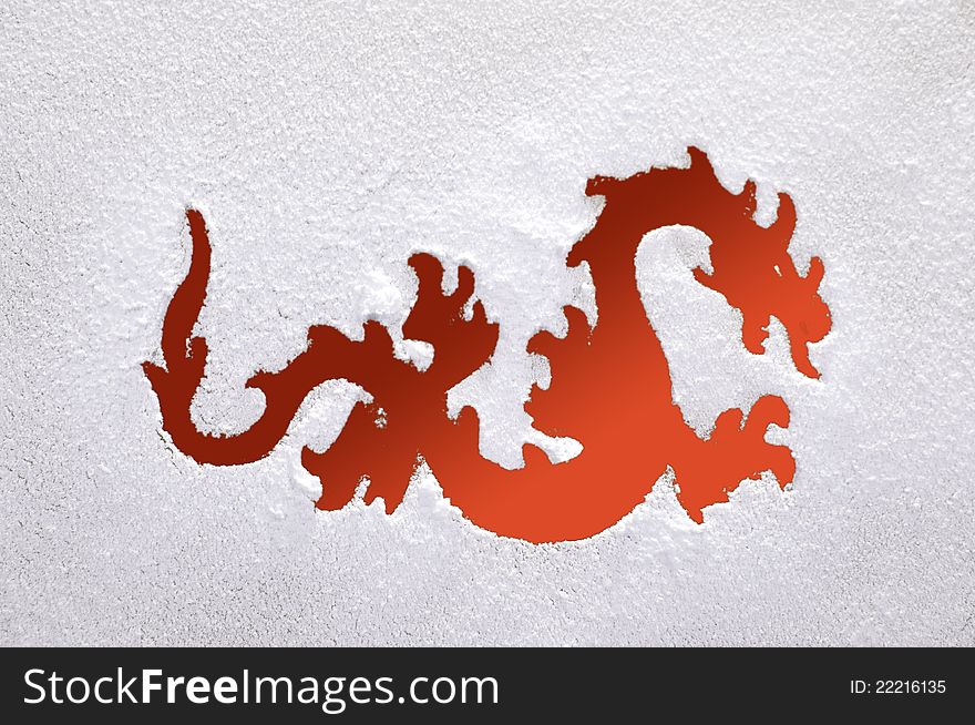 Photography of a fiery dragon on a frozen window. Symbol of new year.