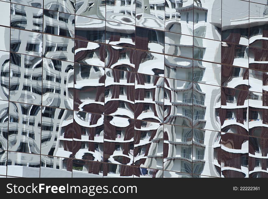 Reflection in a mirror image of the building.