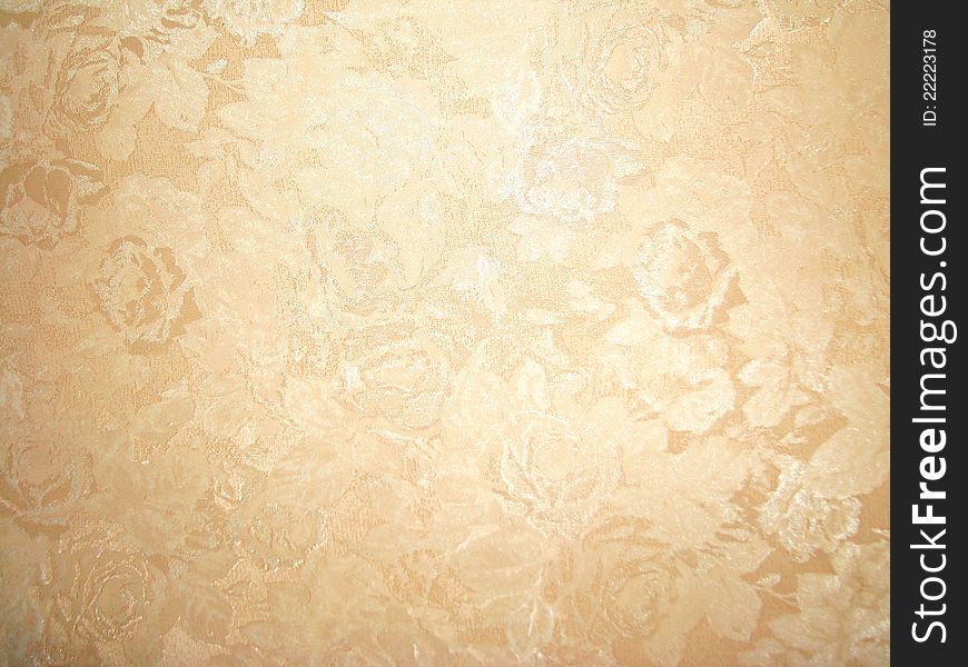 The light brown pattern on the wallpaper. The light brown pattern on the wallpaper