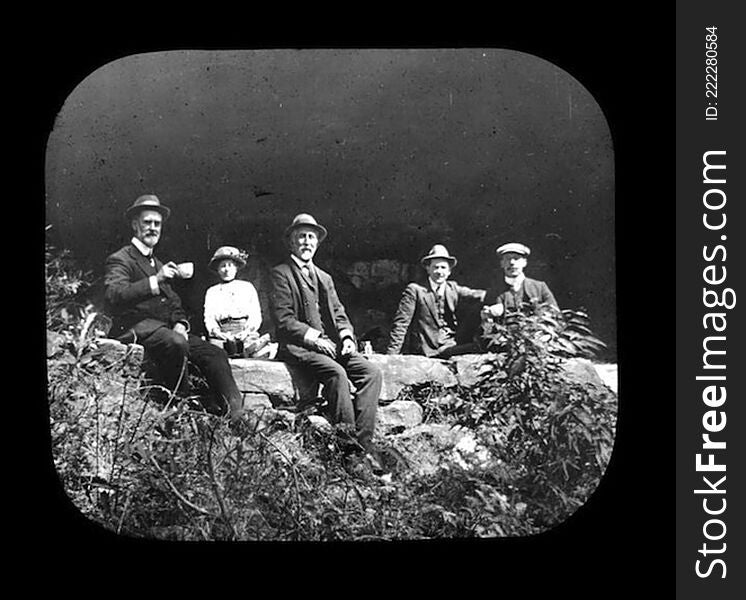 Group portrait of members of Royal Australian Historical Society sitting on rock ledge, taken during excursion to King&#x27;s Cave, Linden. Frank Walker on left, holding teacup.

This image is part of a collection entitled â€˜Blue Mountains Excursions&#x27;, which is available to view on the Royal Australian Historical Society&#x27;s Historypin Channel. Access the collection at the following link: 

http://www.historypin.com/channels/view/id/48441/#|collections/view/id/3230/title/Blue Mountains Excursions

Please feel free to comment on this or any of the other images in the collection. If you have more accurate information regarding the location and/or date of the image, we would love to hear from you!. Group portrait of members of Royal Australian Historical Society sitting on rock ledge, taken during excursion to King&#x27;s Cave, Linden. Frank Walker on left, holding teacup.

This image is part of a collection entitled â€˜Blue Mountains Excursions&#x27;, which is available to view on the Royal Australian Historical Society&#x27;s Historypin Channel. Access the collection at the following link: 

http://www.historypin.com/channels/view/id/48441/#|collections/view/id/3230/title/Blue Mountains Excursions

Please feel free to comment on this or any of the other images in the collection. If you have more accurate information regarding the location and/or date of the image, we would love to hear from you!